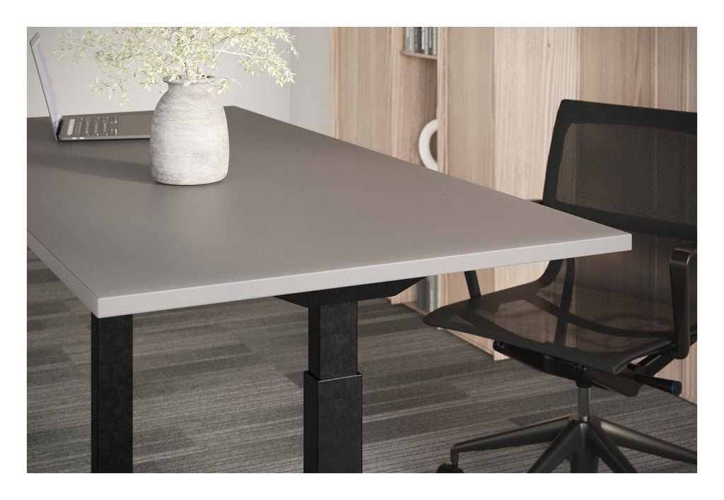 Apex Flyga Height Adjustable Desk, in an office
