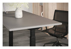 Apex Flyga Height Adjustable Desk, in an office