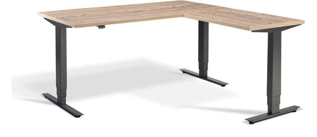 Apex Advance Corner Height Adjustable Desk, in an office