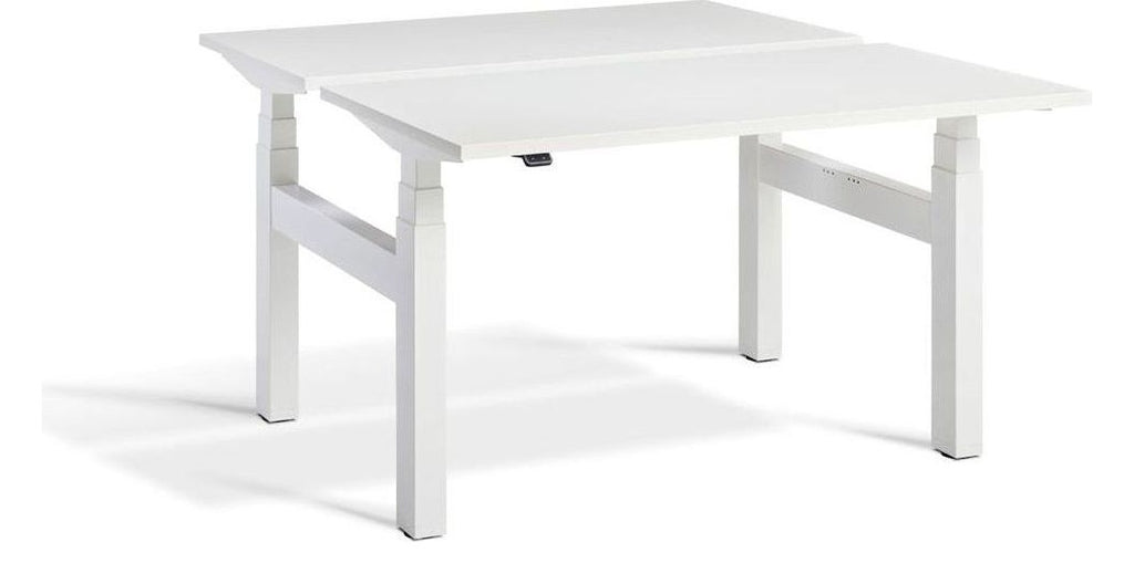 Apex Duo Heavy Duty Back to Back Height Adjustable Desks, in an office