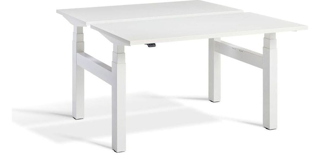 Apex Duo Heavy Duty Back to Back Height Adjustable Desks, in an office