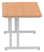 Impulse Pastel straight desk with cantilever legs, shown in oak with a silver frame, view from the side